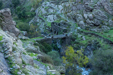 Fototapeta na wymiar stone bridge crossing a river
