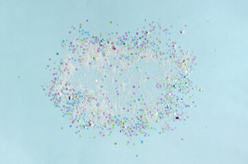 Gently blue background, pastel color, dry sparks scattered in a circle. Dazzling round sequins for embellishment.