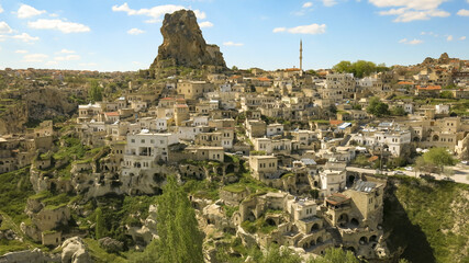 Fototapeta na wymiar The great tourist attraction of Cappadocia on a blue sky day. Cappadocia is known around the world as one of the best places to fly with hot air balloons.