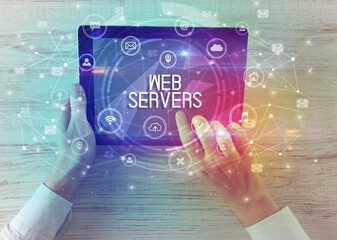 Close-up of a tablet with WEB SERVERS inscription, innovative technology concept