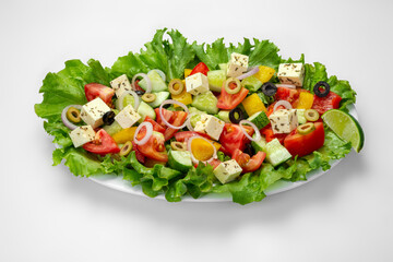 Greek salad with fresh vegetables, feta cheese and black olives