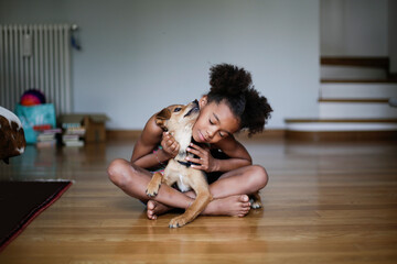 Little girl with her puppy