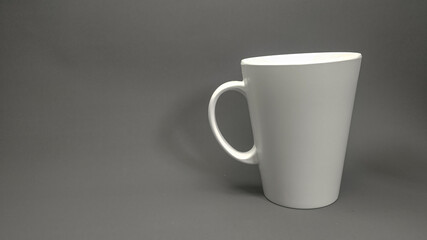 white cup on black background