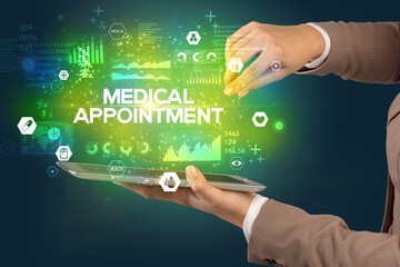 Close-up of a touchscreen with MEDICAL APPOINTMENT inscription, medical concept
