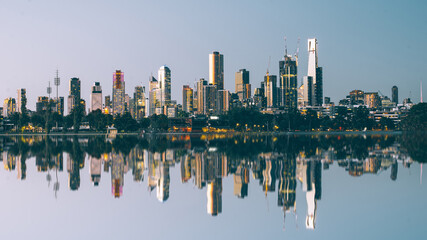 Fototapeta na wymiar City skyline reflected across water 
