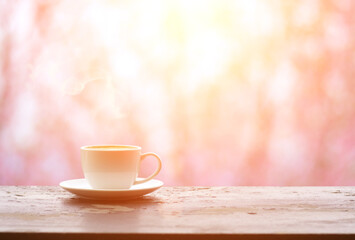 Coffee espresso on wood table nature background in garden,warm tone