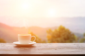 Coffee espresso on wood table nature background in garden,warm tone