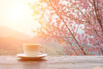 Coffee espresso on wood table nature background in garden,warm tone