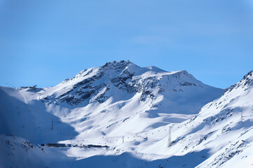 Mountains covered with fresh snow on cold winter day in popular ski resort Obergurgl/Hochgurl in Austria.