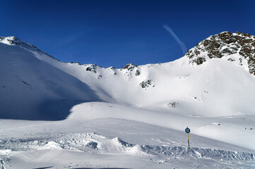 Panoramically view over Austrian alps in Tyrol covered with snow.