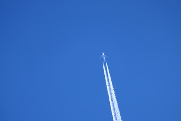 airplane flying over the blue sky