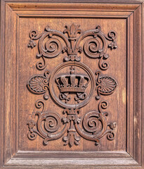 Elegant traditional wooden decoration at entrance door.