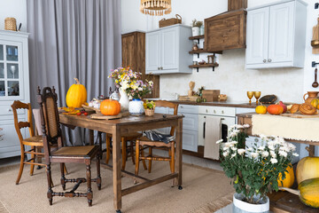 Autumn interior and still life. Pumpkins, apples, zucchini, autumn leaves and flowers. Background. Postcard. Flat lay.