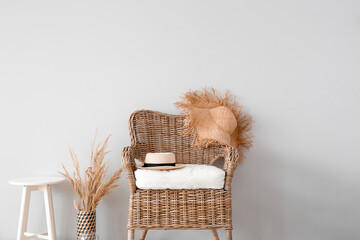 Wicker armchair in interior of living room