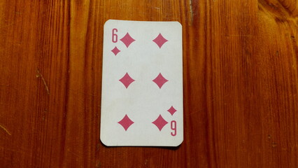 playing card on a wooden background
