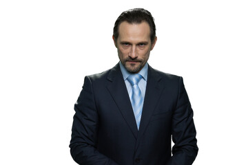 Rich well-dressed businessman. Portrait of serious handsome boss isolated on white background.
