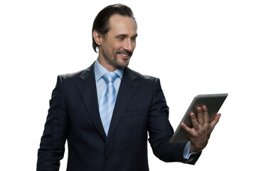 Smiling middle-aged male using digital tablet. Portrait of attractive formal-dressed businessman isolated on white background.