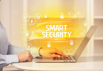 SMART SECURITY inscription on laptop, internet security and data protection concept, blockchain and...