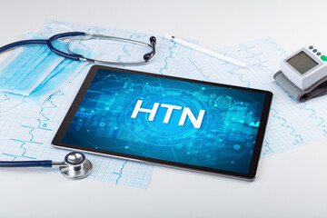 Close-up view of a tablet pc with HTN abbreviation, medical concept
