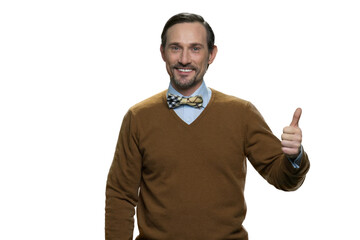 Positive middle-aged man in browm sweater with bowtie. Caucasian casual-dressed man isolated on white background.