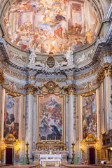 Fototapeta premium ROME, ITALY - 2014 AUGUST 18. Interior of the Church of St. Ignatius of Loyola at Campus Martius ,Italian Chiesa di Sant'Ignazio. Beautiful chapel with old frescoes and candles.