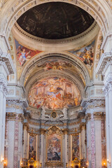Fototapeta na wymiar ROME, ITALY - 2014 AUGUST 18. Interior of the Church of St. Ignatius of Loyola at Campus Martius ,Italian Chiesa di Sant'Ignazio. Beautiful chapel with old frescoes and candles.