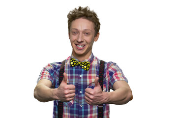 Portrait of cheerful guy is showing two thumbs up. Isolated on white background.