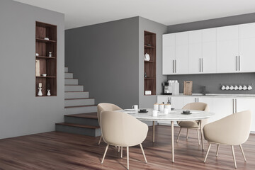 Grey and white kitchen corner with round table