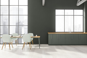 Grey kitchen with dining table and window
