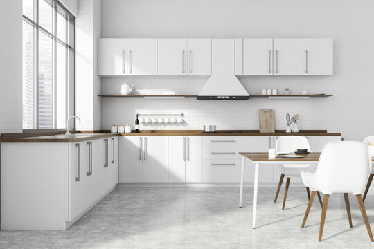 White kitchen interior with dining table