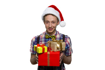 Portrait of a young guy with gift boxes. Christmas presents concept. Isoalted on white.