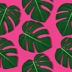 Bright tropical leaves on pink background pattern