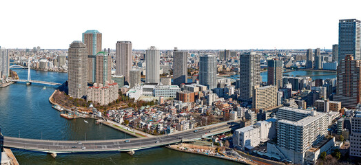 Panoramic view of Sumida river in Tokyo with wavy water, boats, bridges and skyscrapers from above
