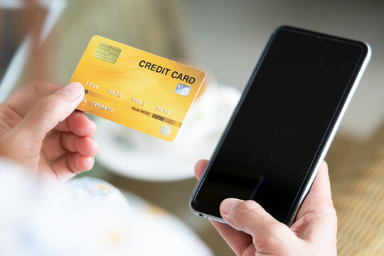Online payment and shopping concepts.Woman shopping online with smart phone and credit card..