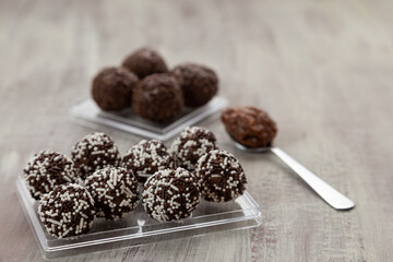 chocolate candies on a wooden background