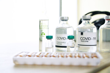 Covid-19 Vaccine in clear the bottle for Research and treatment for virus infection patients in science laboratory.