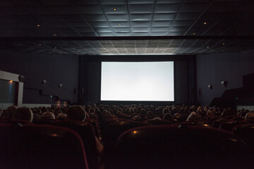 Empty cinema screen with audience. Ready for adding your picture. - obrazy, fototapety, plakaty