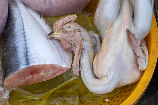 close up of dead Tuna and Chicken in a Vietnamese food market
