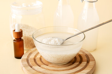 Healthy rice water on color background