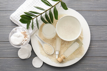 Healthy rice water with cosmetic supplies on table