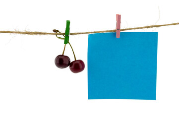 Fresh fruit hanging from clothes pegs on a rope