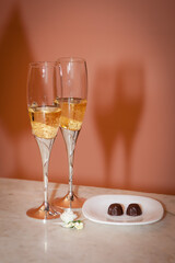 Two wedding glasses with champagne on the table. Wedding.