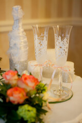 Two wedding glasses with champagne on the table. Wedding.