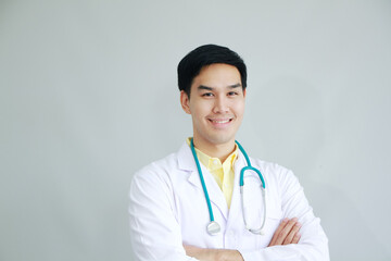 Smiling Professional Asian man Psychiatrist (MD) and smart doctor in White gown uniform with Stethoscope portrait.