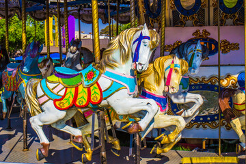 Fototapeta na wymiar Merry Go Round Horses On Carousel