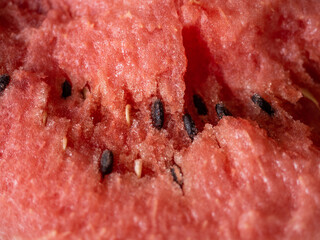 Juicy ripe watermelon in half on a white table