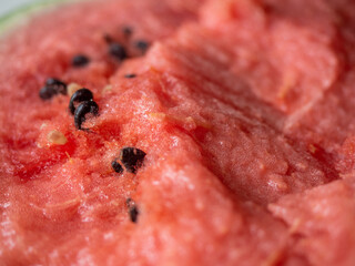 Juicy ripe watermelon in half on a white table
