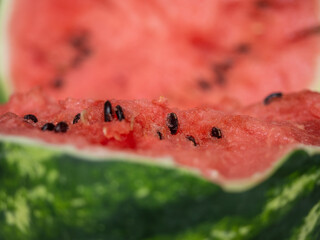Juicy ripe watermelon in half on a white table