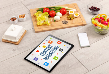 Healthy Tablet Pc compostion with CONTENT MARKETING inscription, Social networking concept