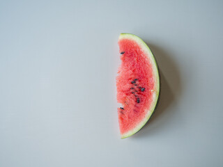 Juicy ripe watermelon in half on a white table
